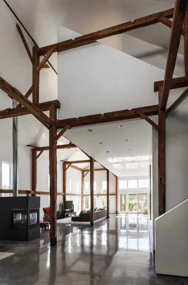 White volumes and exposed wooden structure