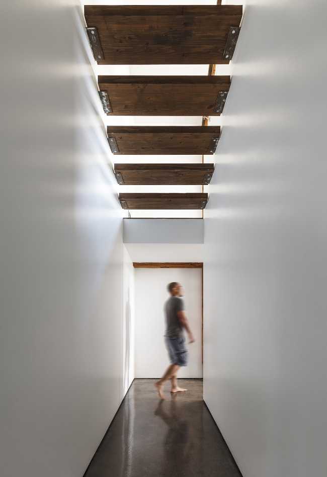 White corridor and wooden roof