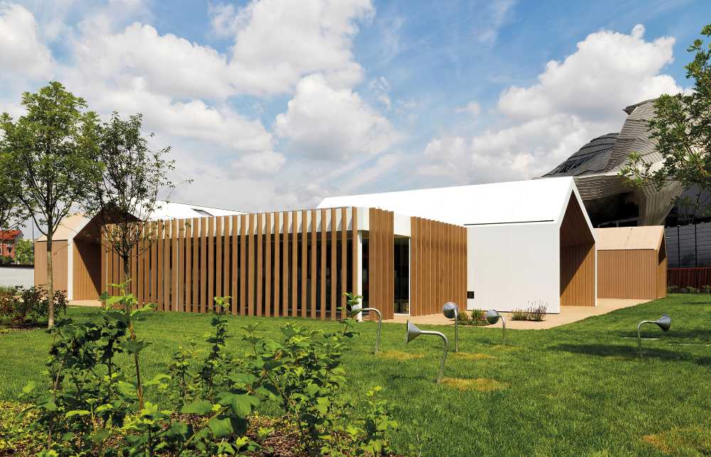 Wooden nursery in relation to the surrounding park