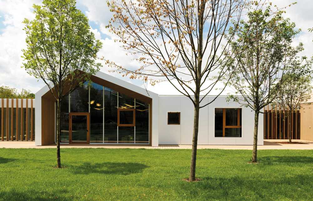 Wooden nursery in relation to the surrounding park