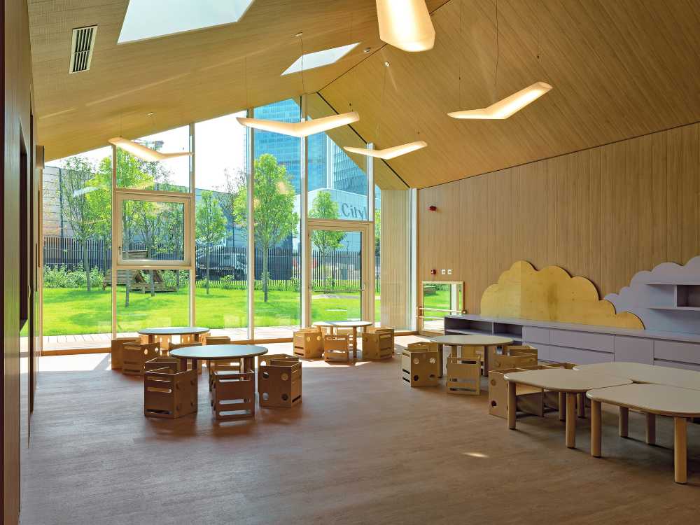 Wooden nursery in relation to the surrounding park