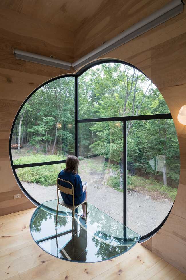Round windows open onto the landscape