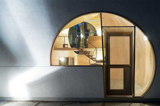 Wooden house lighting in the woods