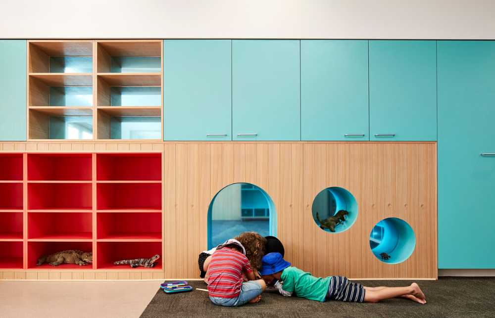 Interior of a school with colored wooden furniture