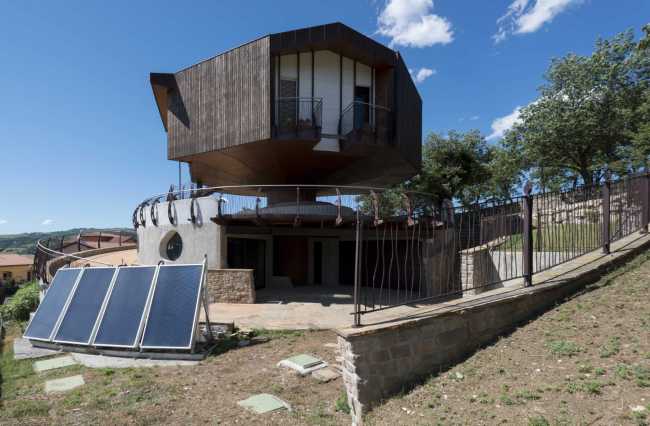 Wooden house and photovoltaic panels