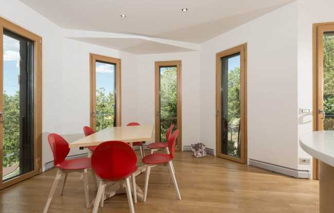 Interior in white and wood with high windows