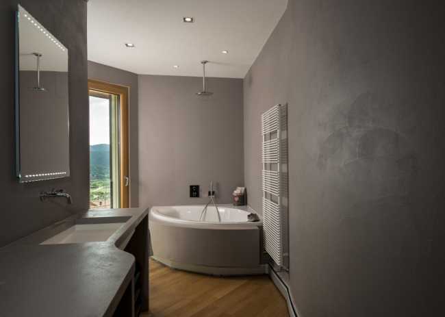 Gray bathroom with tub