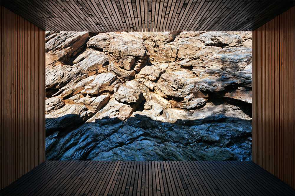Dark and light wooden villa on the rock