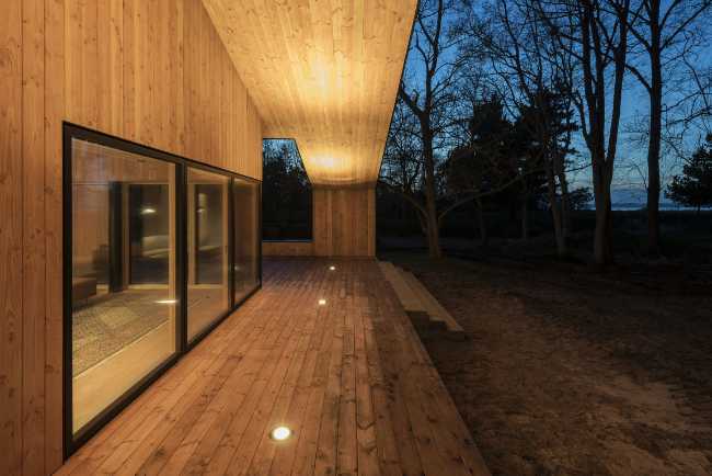 Perimeter of an illuminated wooden house