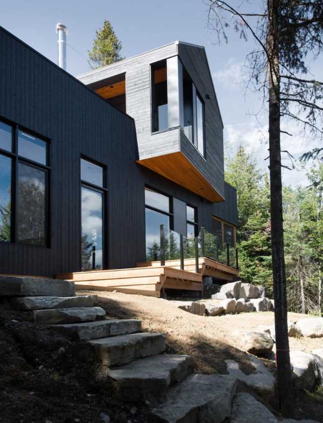 Wooden staircase on a slope leading to the house