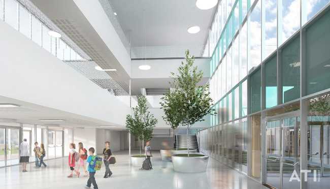 Atrio a doppia altezza con vetrate