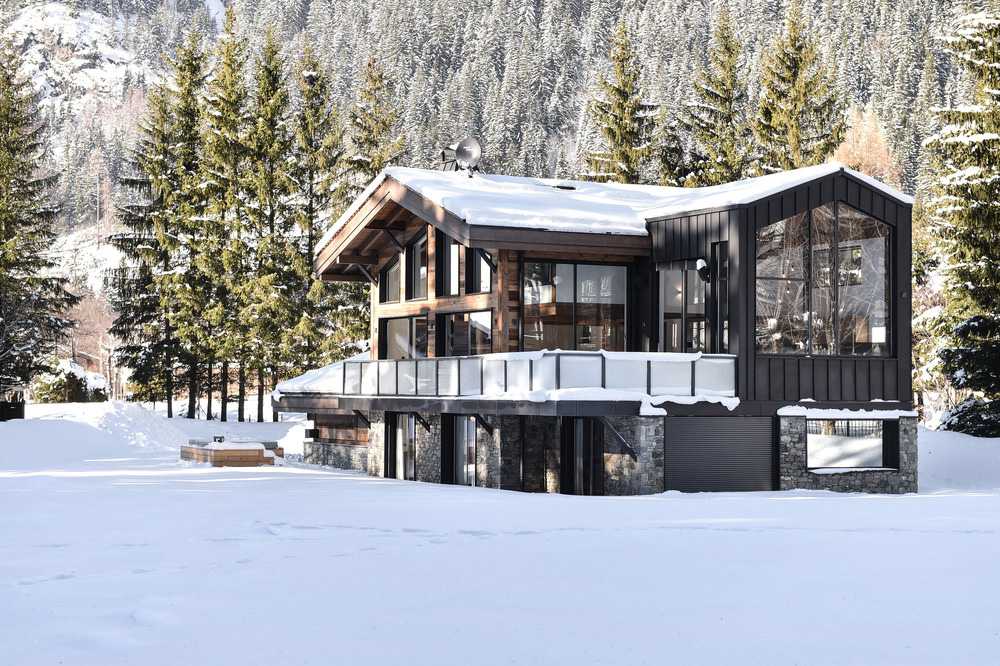 Wooden cottage in the snowy mountains