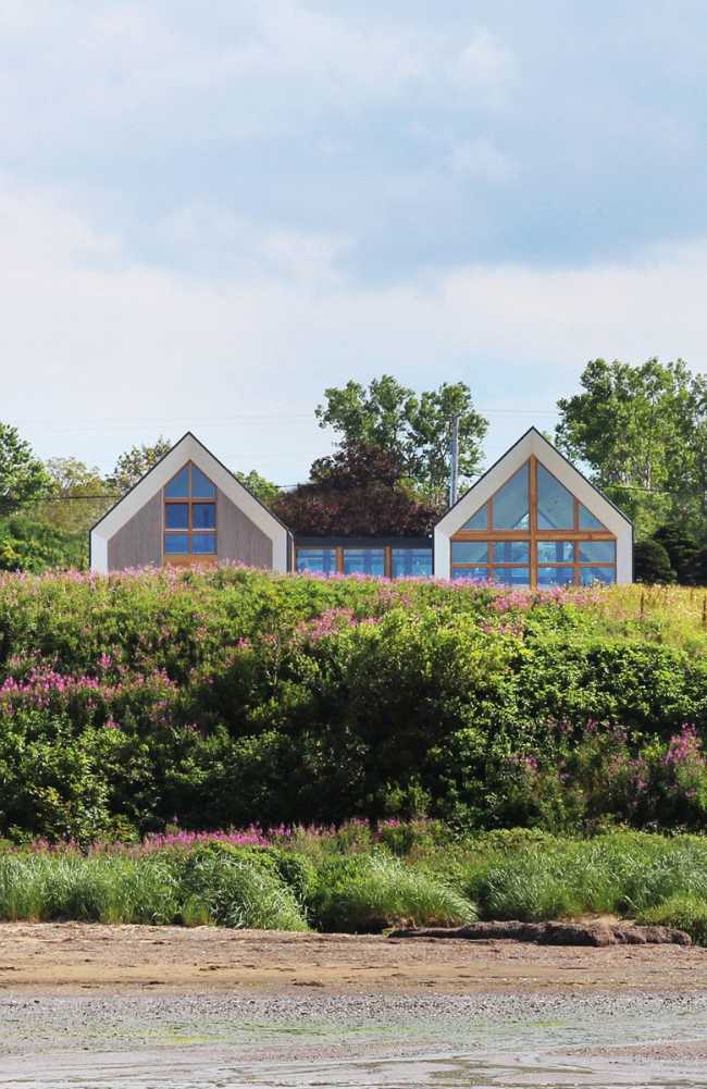 Wooden house with two pitched roof blocks