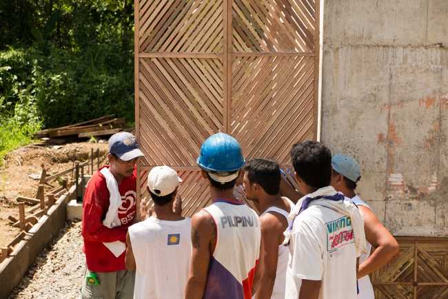 Children and wooden reconstruction