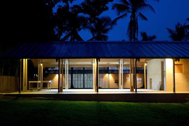 Wooden building illuminated at night