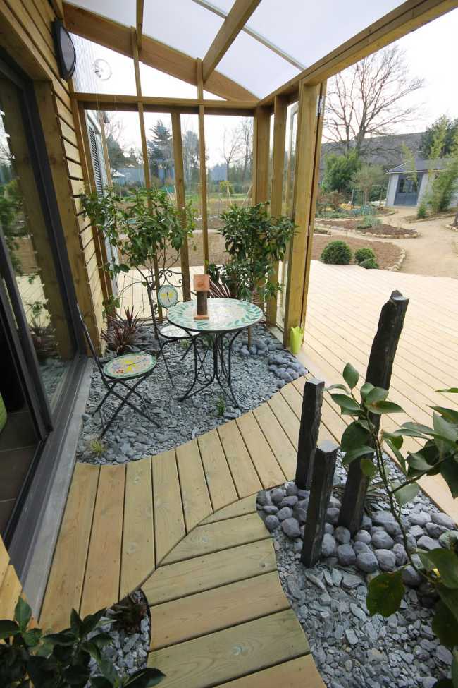 Wooden veranda with wooden and stone floor