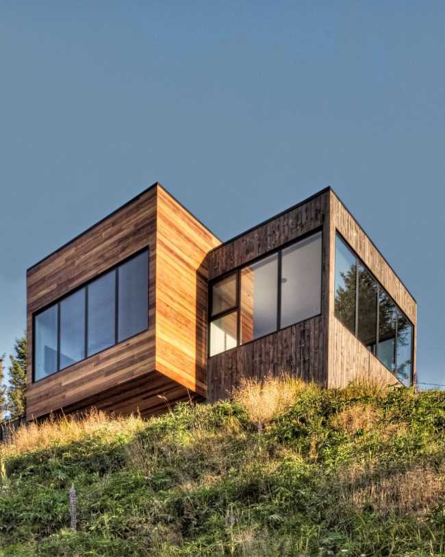 residenza in legno con vista dal pendio