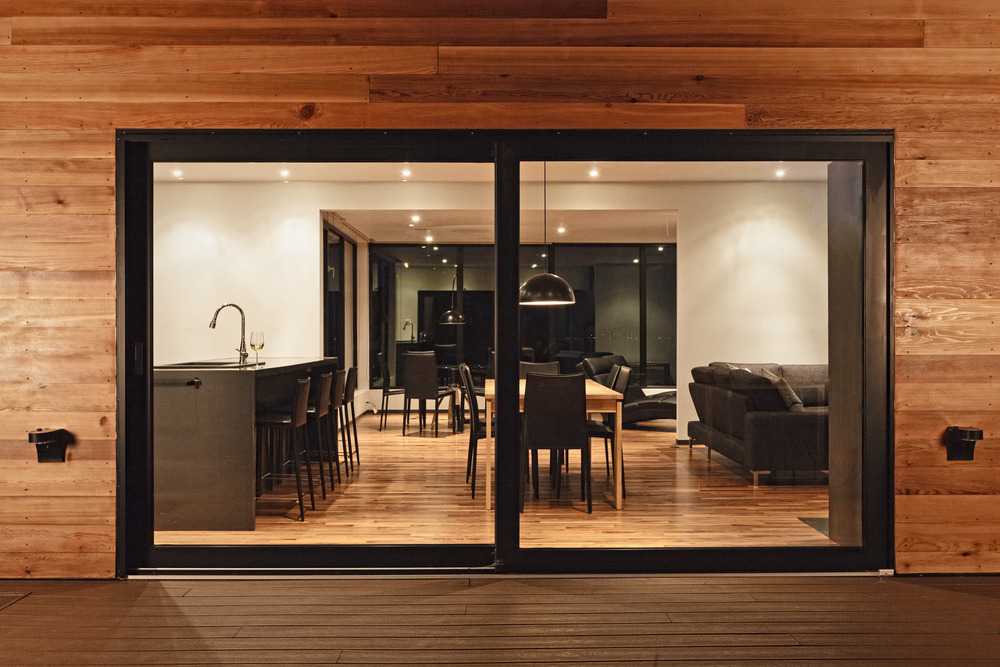 Wooden residences with large windows