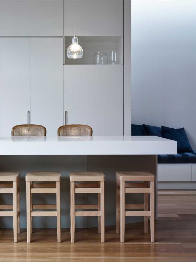 White furniture and wooden stools