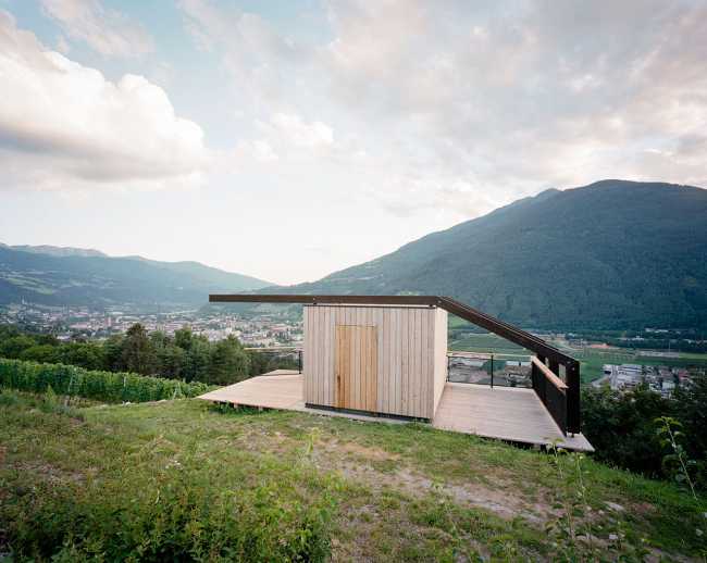 Larch cube on a wooden platform