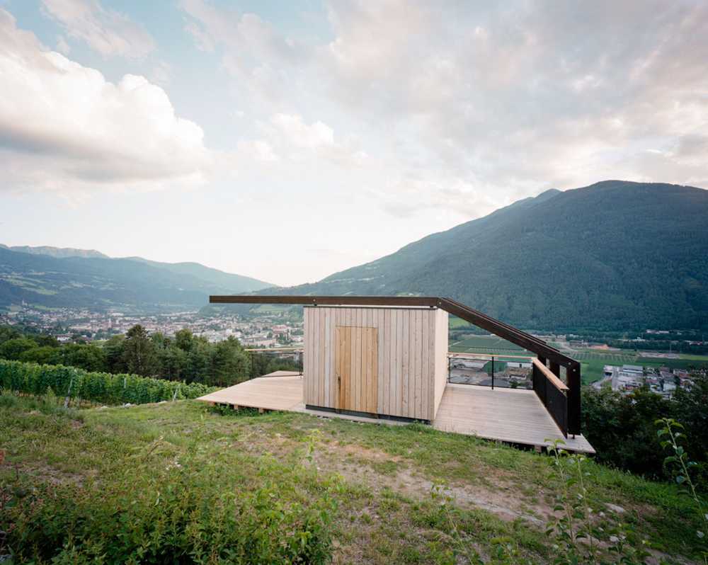 Mountain landscape with wooden architecture at its centre
