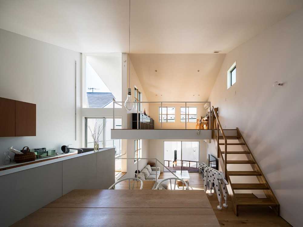 Cantilevered wooden house with horizontal slats