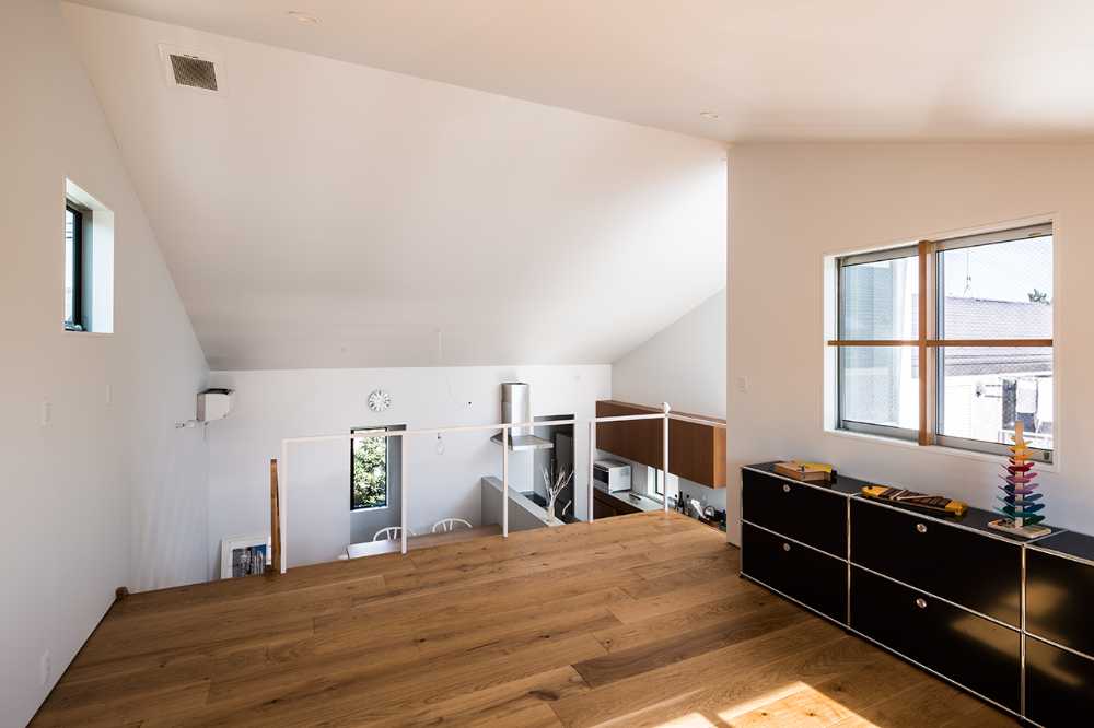 Cantilevered wooden house with horizontal slats
