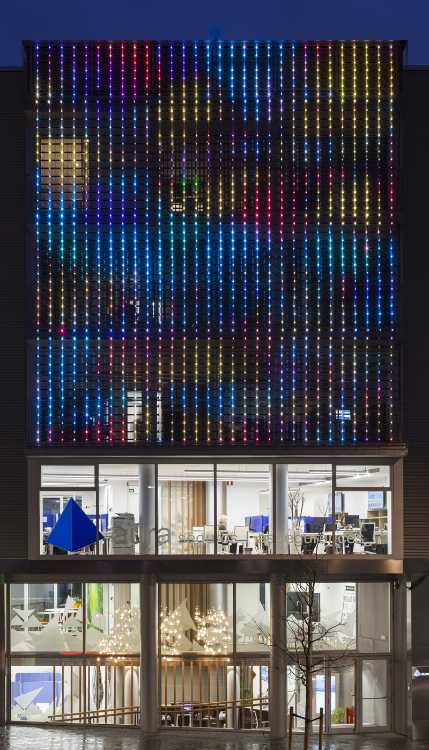 Night facade perforated metal colored lights