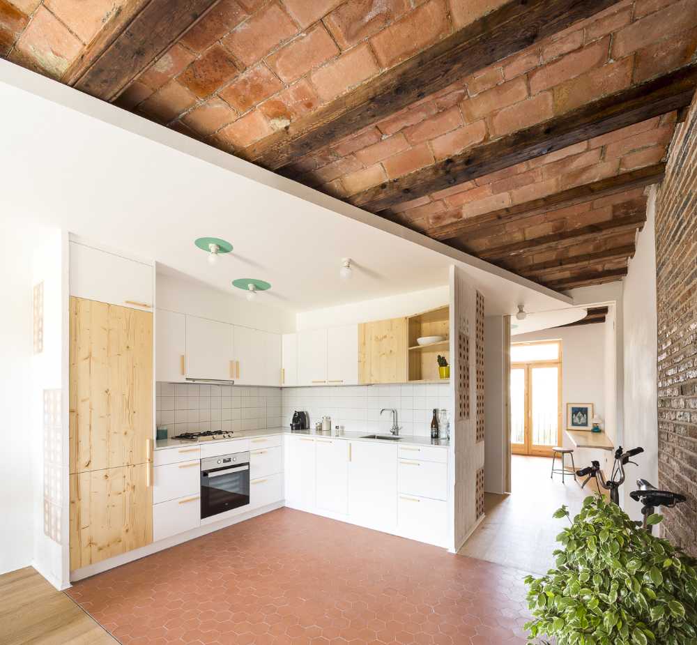 ceiling brick vaulted white kitchen with counter continuous