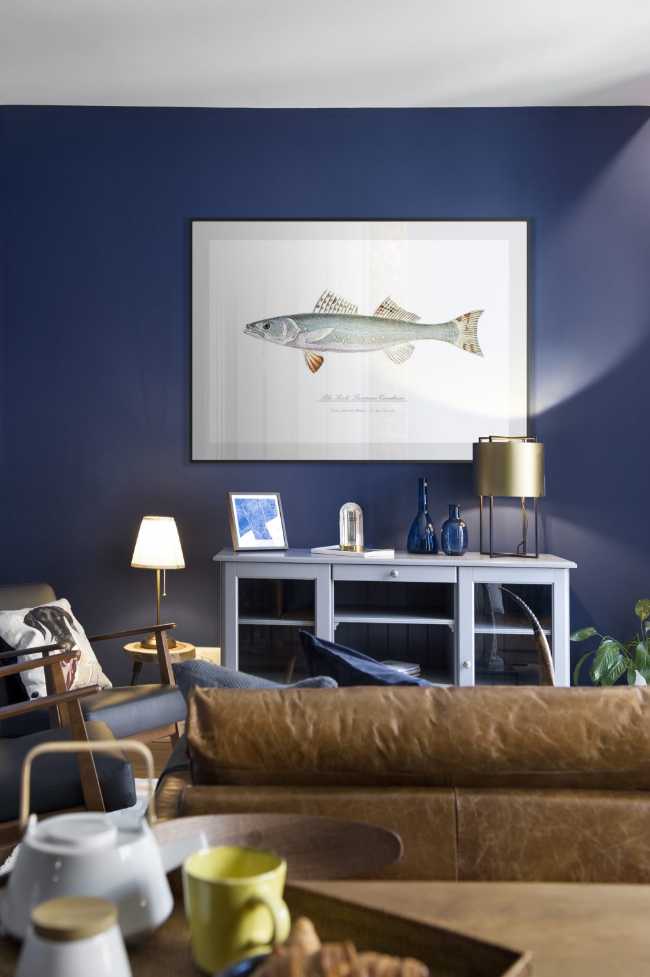 Apartment with blue wall and picture
