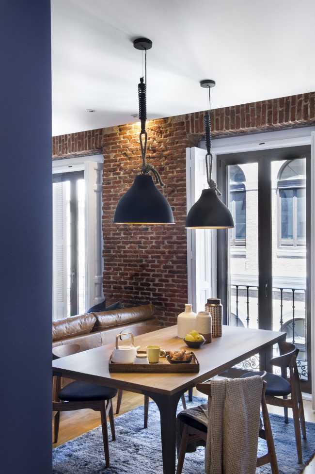 Interior apartment with bricks and blue wall