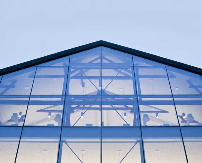 Traditional shapes and glazed facade for a company