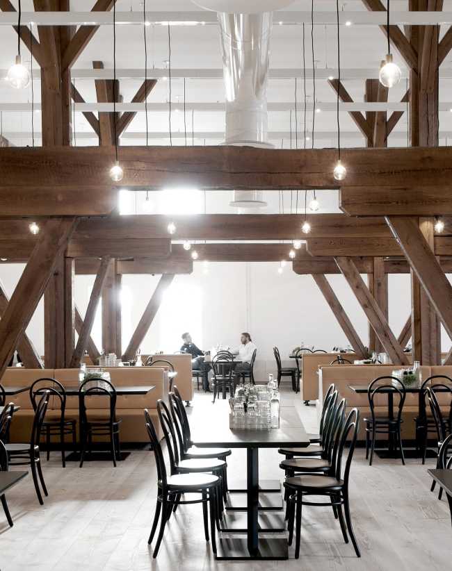 Bar area of a company with exposed wooden structure