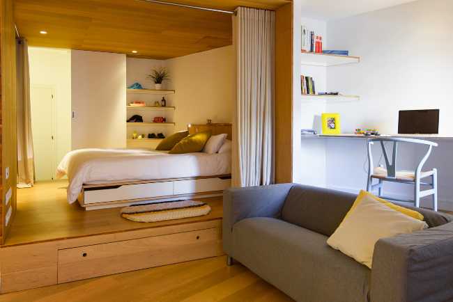 Wooden bedroom with sofa and desk