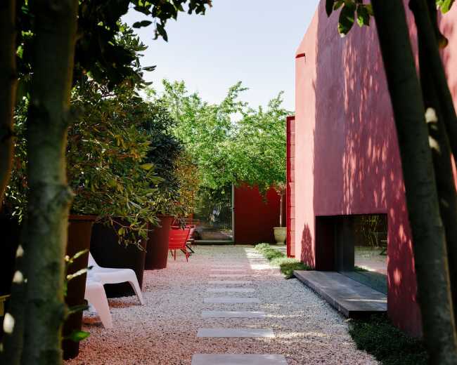 External space of a red villa