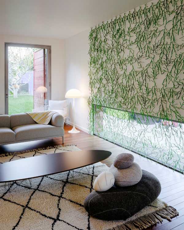 Diano gray oval table and green wall