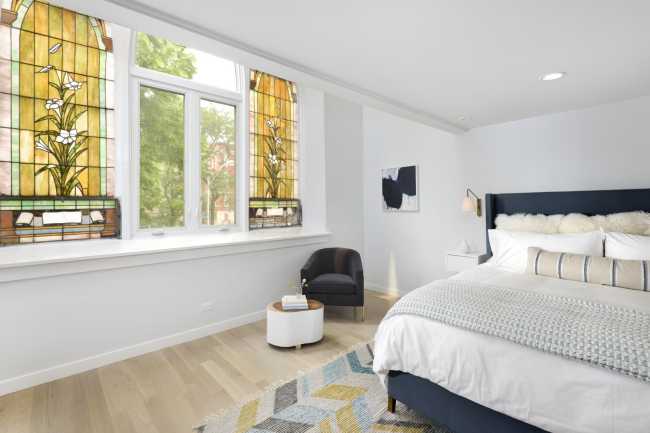 Bedroom with stained glass window