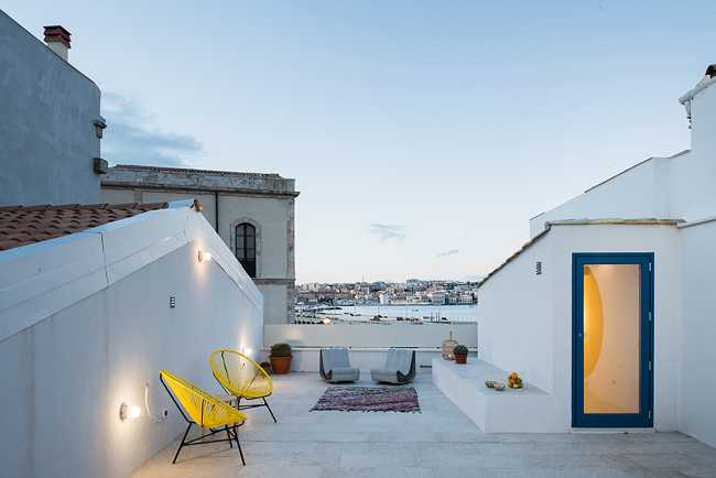 White terrace overlooking the sea and soft lighting