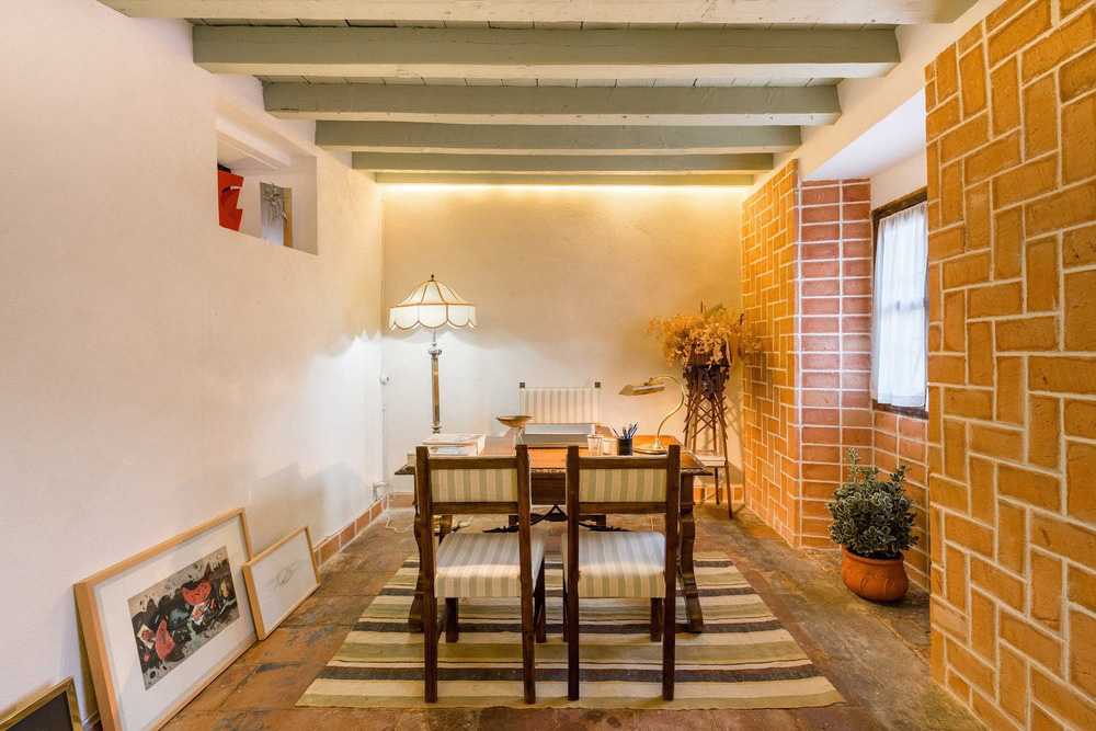Space with barrel vault and stone wall