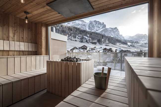 Sauna with glass window on the landscape