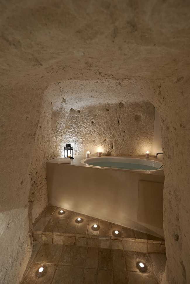 Bathroom with stone walls