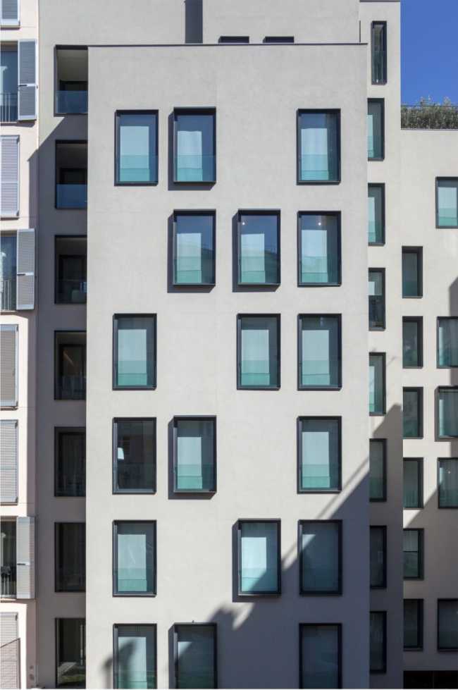 Minimal facade with windows and small balconies
