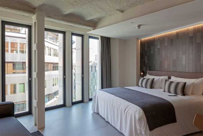 Bedroom with large windows of a hotel