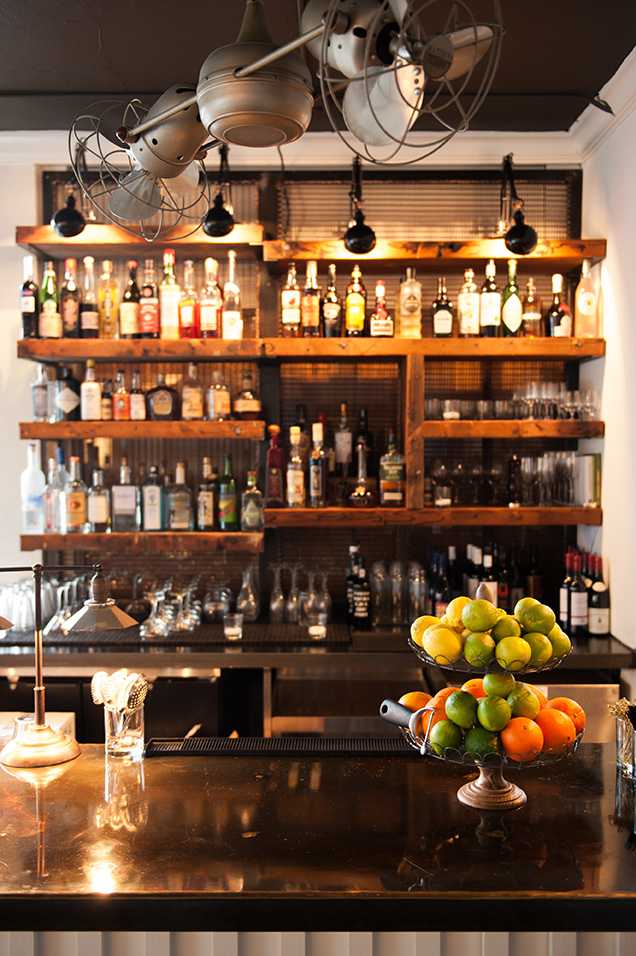 Bar with wall of shelves and alcohol
