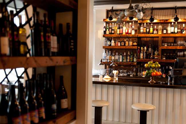 Restaurant with shelves full of drinks