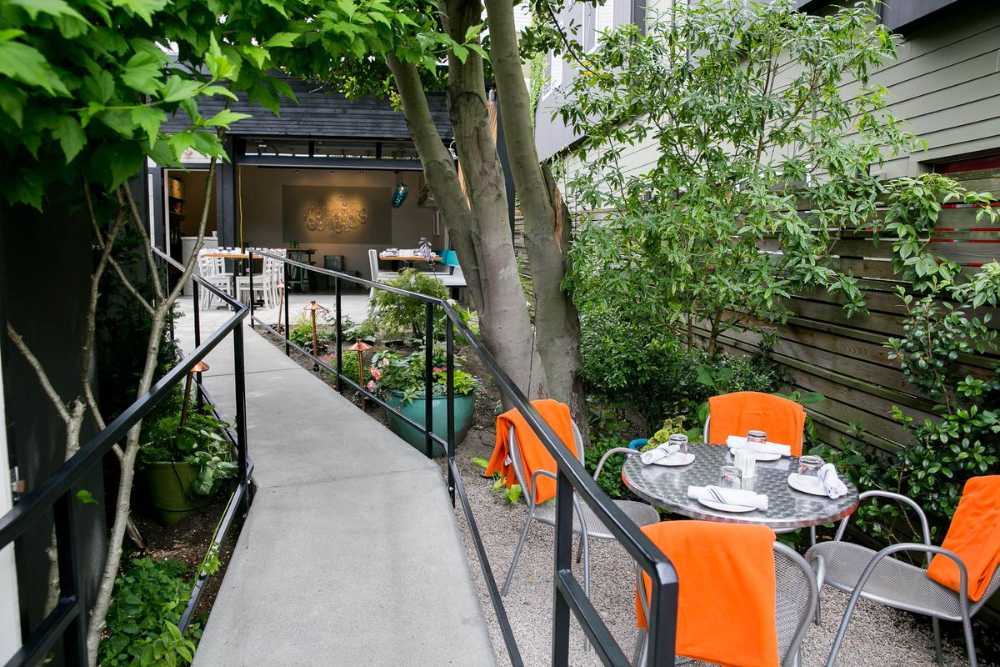 Interior restaurant in white wood and colored sofas