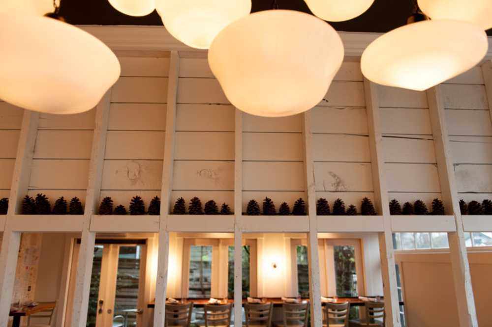 Interior restaurant in white wood and colored sofas