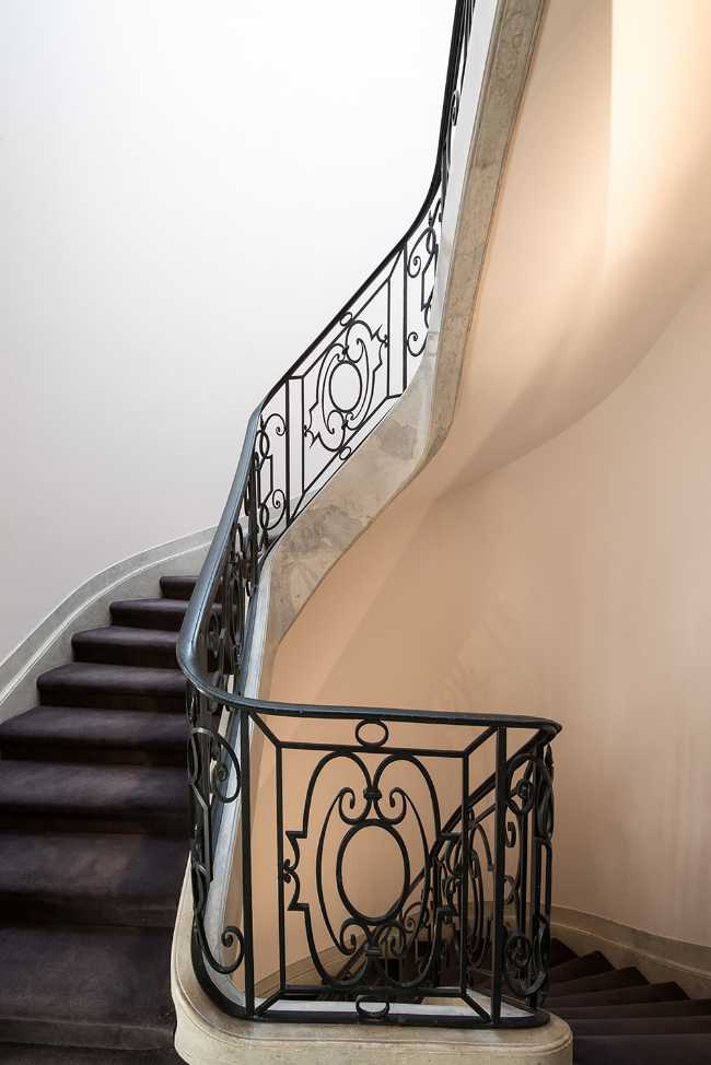 historical villa with wrought iron banister
