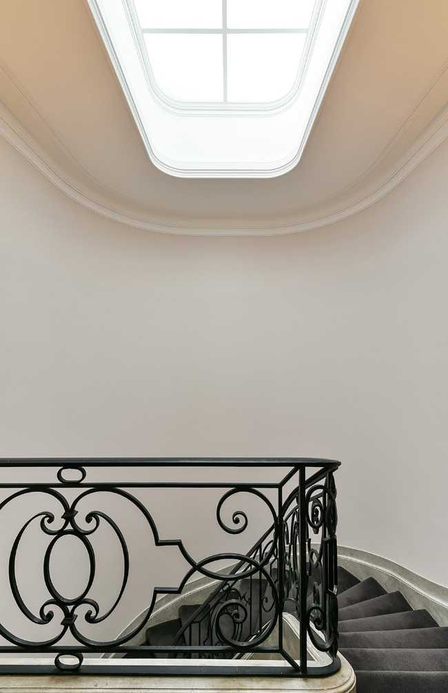 historical staircase with wrought iron baniste