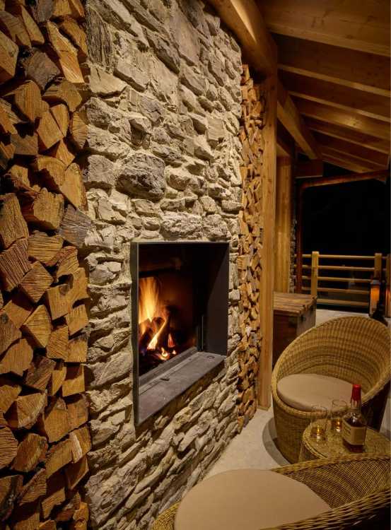 Resort with antique wooden structure and stone cladding